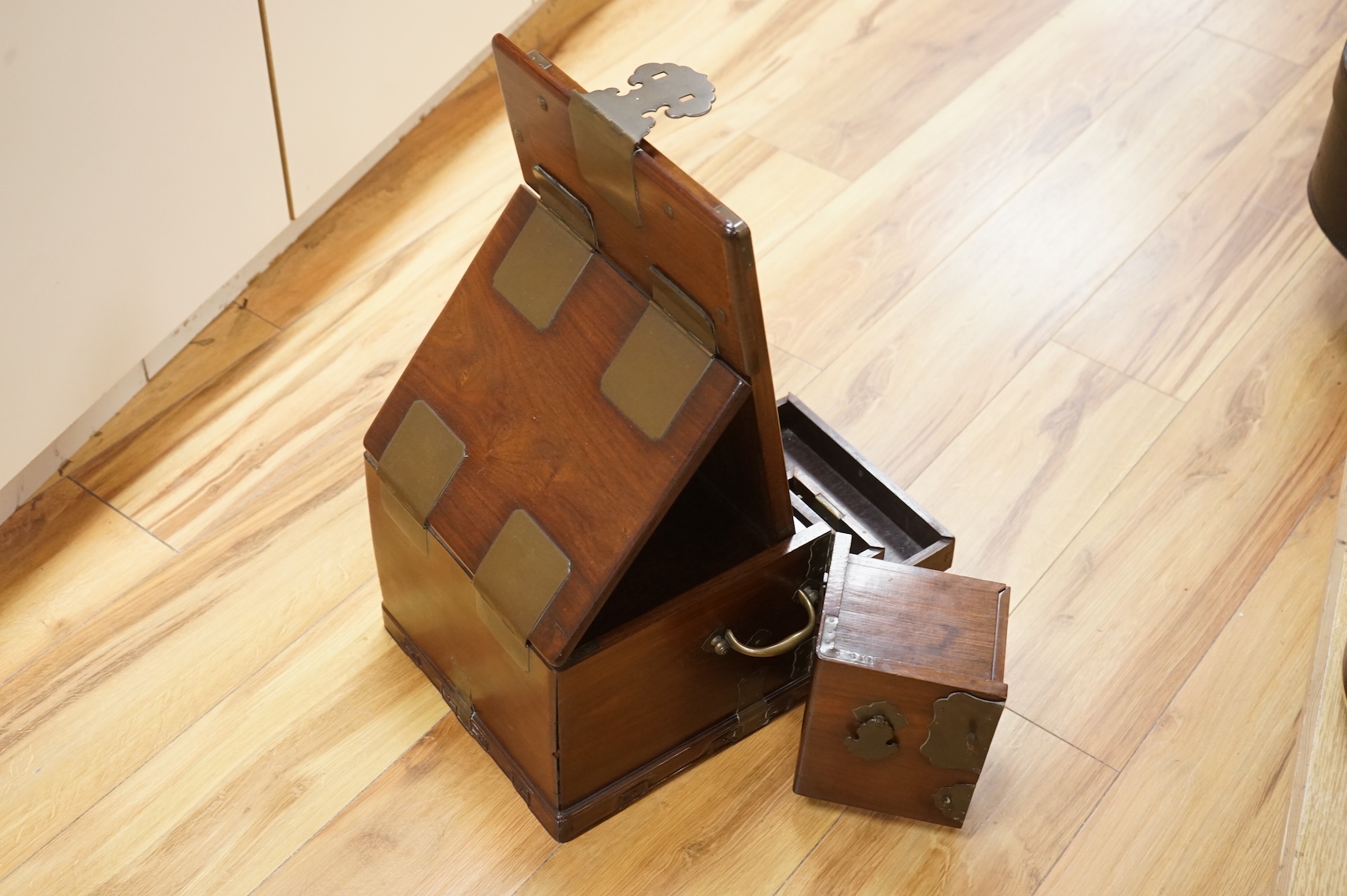 A Chinese rosewood brass bound dressing chest, closed 39cm deep, 29cm wide, 23cm high.
